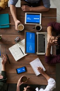 group working on laptop and tablet