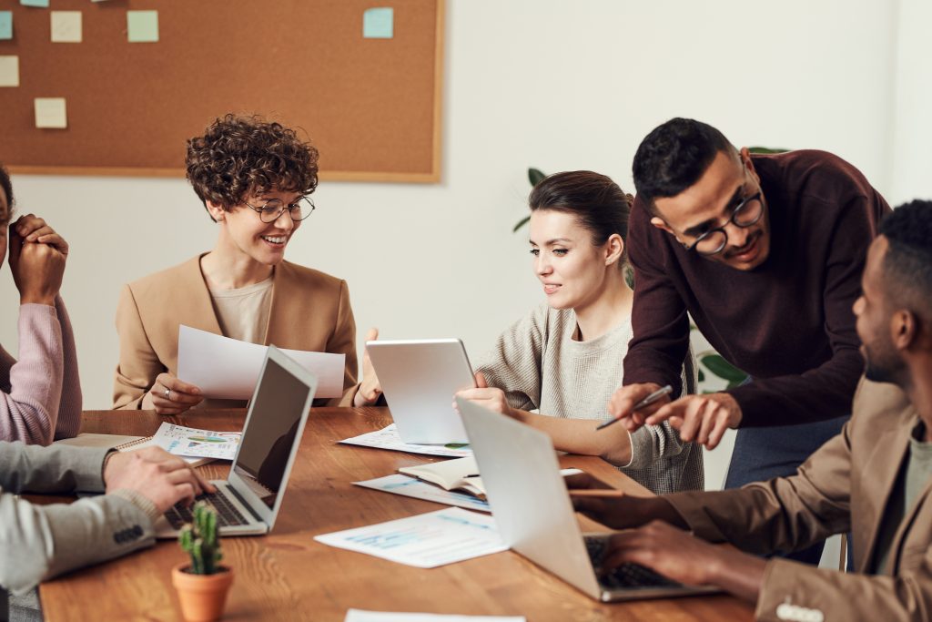 coworkers meeting with laptops