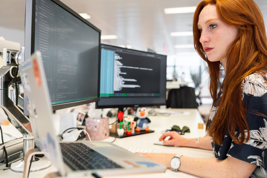 woman coding on a computer