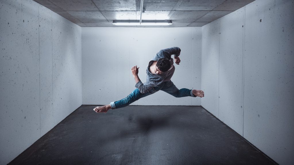 dancer in the air inside a room without windows
