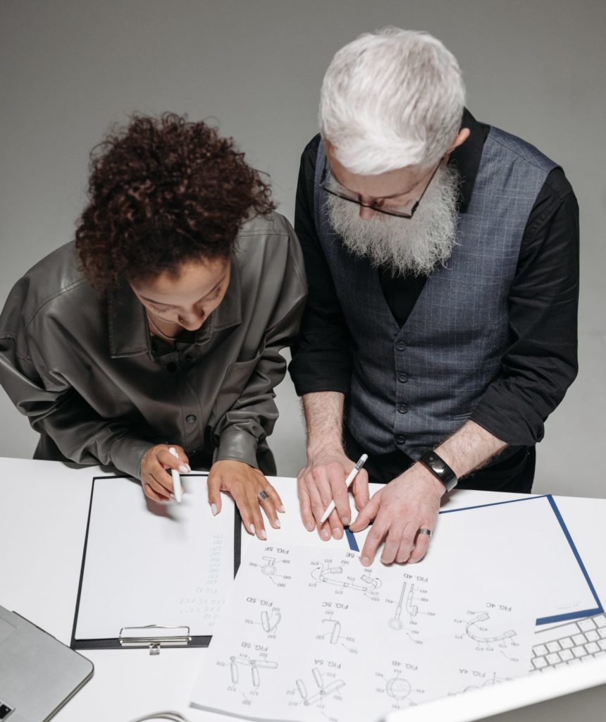 two people working on wireframes